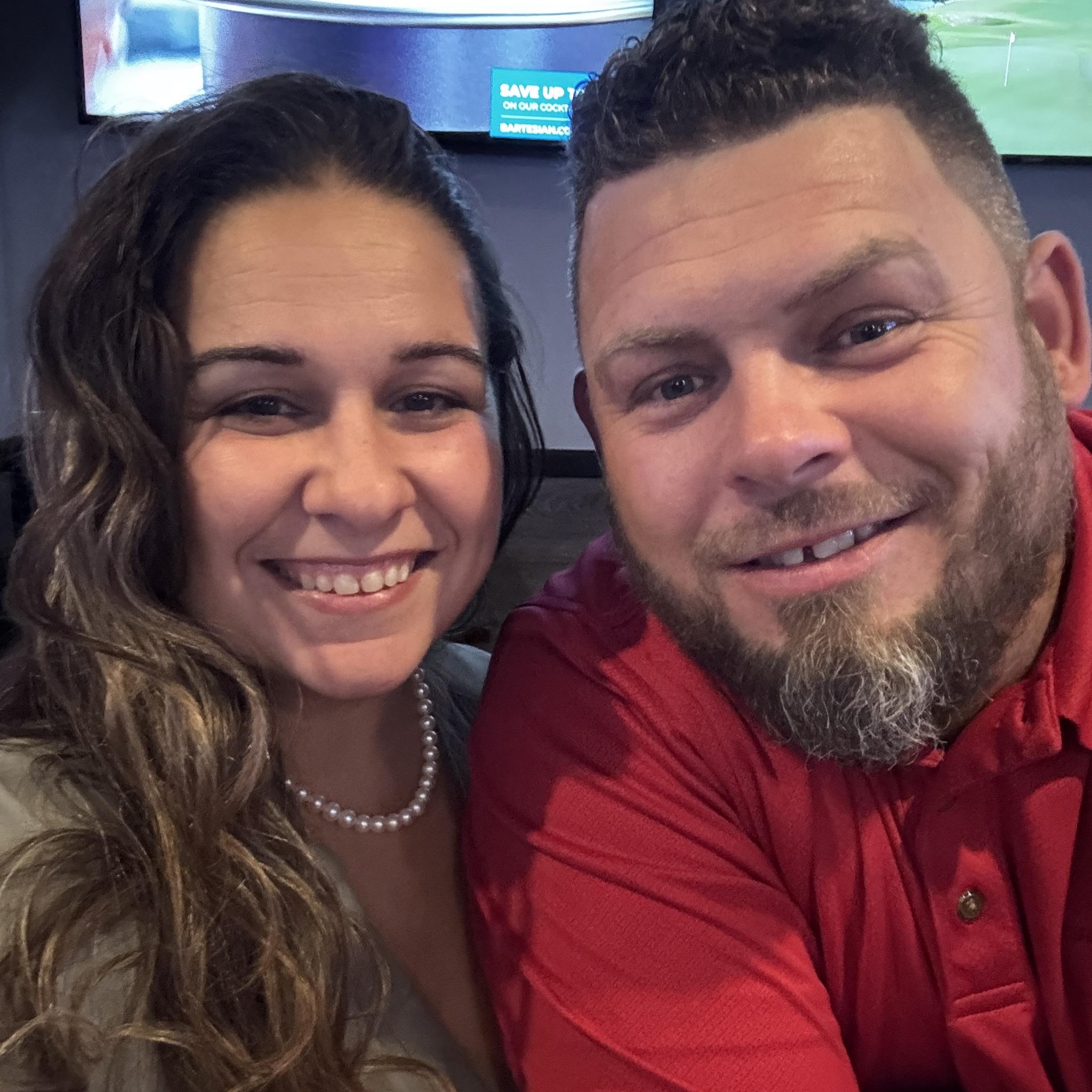 Brenden Moore and Asia Moore smiling together, showcasing their teamwork and commitment to Moore Electric Inc., emphasizing family-oriented values in their electrical services.